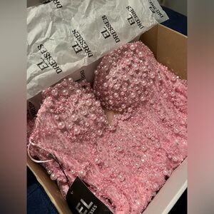 Custom made dress, comes with the tagg on and its original box.